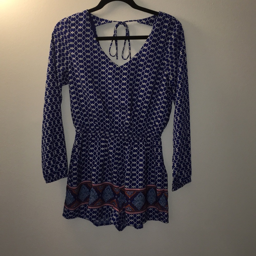 Blue patterned long sleeved romper. Gently worn